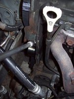 deze zelfgemaakte pen m8 drukt tegen de hefboom van de zelfspanner om de spanrol in te kunnen stellen